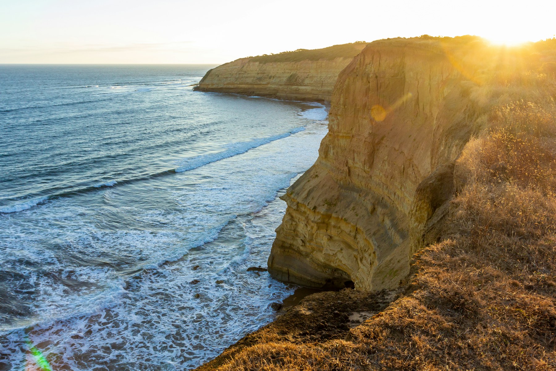 Sunlight falling across the cliffs and sea at Jan Juc